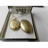 A 9ct gold locket on a fine gold chain and another 9ct gold locket, 10 grams.