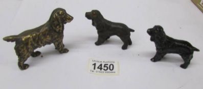 A bronze cocker spaniel and 2 spelter spaniels.