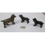 A bronze cocker spaniel and 2 spelter spaniels.