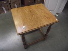 A polished oak side/coffee table, (collect only).