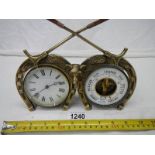 A good early 20th century brass horse shoe clock/barometer, barometer missing glass.