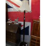 A 1930's floor standing lamp with oriental carving.