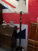 A 1930's floor standing lamp with oriental carving.