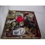 A mixed lot of costume jewellery, brooches, cuff links etc.