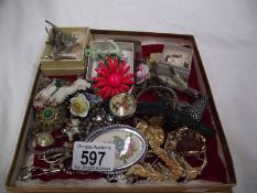 A mixed lot of costume jewellery, brooches, cuff links etc.