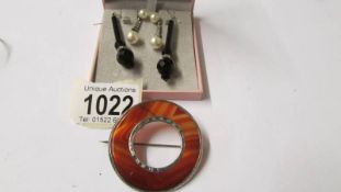 Two pairs of pendant earrings and a Scottish brooch,
