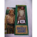 A boxed Mattel Grizzly Adams action figurine.