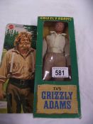 A boxed Mattel Grizzly Adams action figurine.