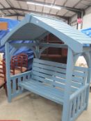 A garden arbour with bench