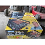A boxed tile cutter