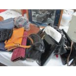A large quantity of purses and handbags