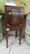 An Edwardian mahogany inlaid pot cupboard.