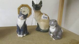 3 Royal Copenhagen cats.