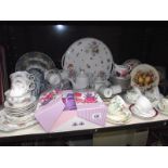 A shelf of tea ware including Royal Doulton trio, Royal Albert part tea set etc.