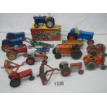 A mixed lot of die cast tractors and farming implements by Britain's, Dinky, Corgi etc.