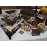 A collection of old tins, some fans, small brass snake etc.