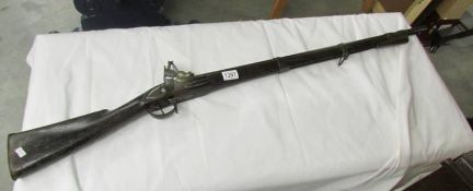 A flintlock rifle.
