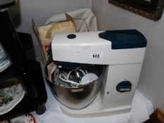A vintage Kenwood mixer with accessories.