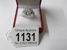 A silver CZ Cartier style panther dress ring set with semi precious stones, size M half.