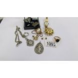 A small mixed lot of costume jewellery including silver watch fob.