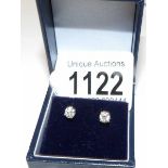 A pair of white gold diamond stud earrings of 75 points.