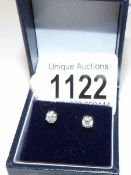 A pair of white gold diamond stud earrings of 75 points.