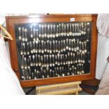 A good collection of souvenir spoons in display case (collect only).