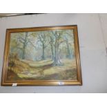 A gilt framed oil on board woodland scene.