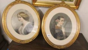 A pair of 19th century oval framed and glazed portraits of ladies.