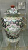 A large lidded Chinese jar.