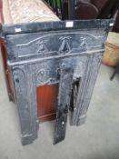 A cast metal fire place