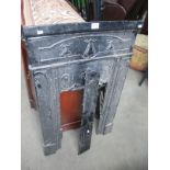 A cast metal fire place