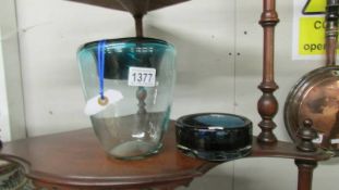 A vintage Danish glass dish with impressed base and a hand made glass vase with rolled green rim.