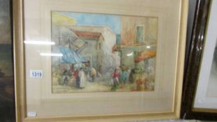 A framed and glazed watercolour of a continental village scene singed Y Y Fawcett, image 37 x 27 cm.