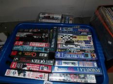 2 boxes of mainly Formula 1 VHS tapes.