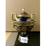 A fine blue & gold glazed Dresden porcelain lidded two handled urn signed by the artist.