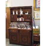 A solid oak dresser with carved rose pattern doors. (collect only).