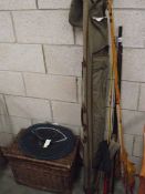 3 old fishing rods with tackle and basket.