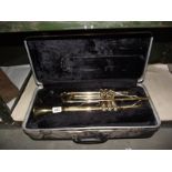 A cased Besson Blessing Scholastic trumpet, no mouthpiece.