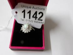 A silver CZ and opal panelled dress ring, size N.
