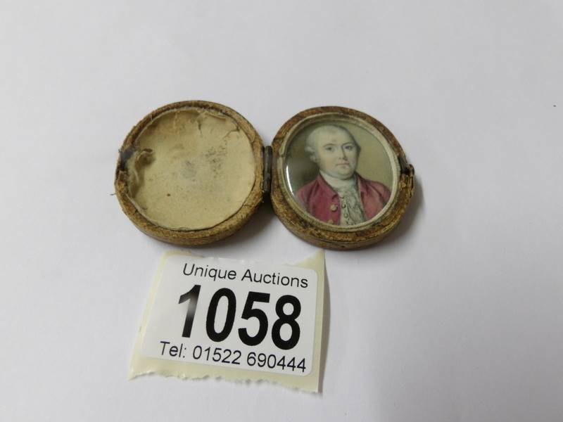 A 19th century miniature portrait painting of a gentleman in case,