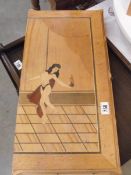 An erotic inlaid backgammon board.