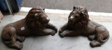 A pair of reclining lion garden ornaments (collect only).