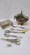 A silver plate sugar scuttle with scoop, a silver plate cigarette box and assorted flatware.