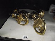 2 brass door knockers and 3 brass door knobs.