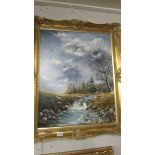 A gilt framed oil on canvas mountain stream scene, signed but indistinct, image 60 x 76 cm.