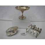 A small hall marked silver chalice, a silver toast rack and a small silver jewel box (worn on lid).