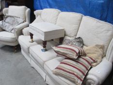A 3 seater settee with matching arm chair and a pouffe