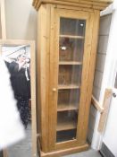 A pine cupboard with glazed door. (collect only).