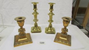 2 pairs of brass candlesticks.